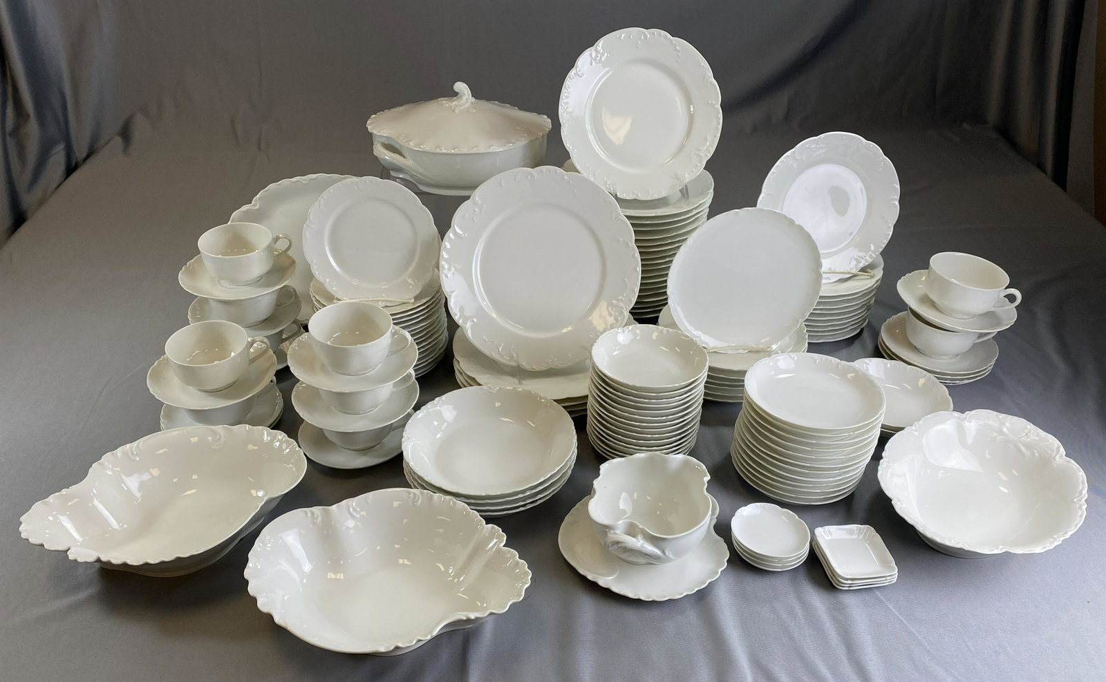 Large Service Haviland Limoges French White China: Classic French white dinnerware Haviland Limoges. Most pieces are marked either "H&C L France" or "Haviland France". There is some variation in the embossed designs but all work well together. The set