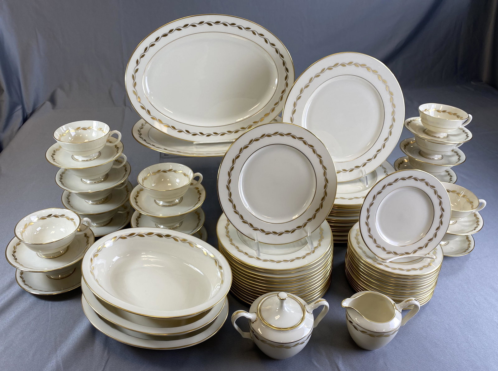 Lenox Golden Wreath Dinnerware Service for 15: Service for 15 in the Golden Wreath pattern by Lenox comprising: (15) 10 1/2" dinner plates, (15) 8 1/2" salad plates, (15) 6 1/2" bread & butter plates, (15) cup and saucer sets, (2) 14" oval platter