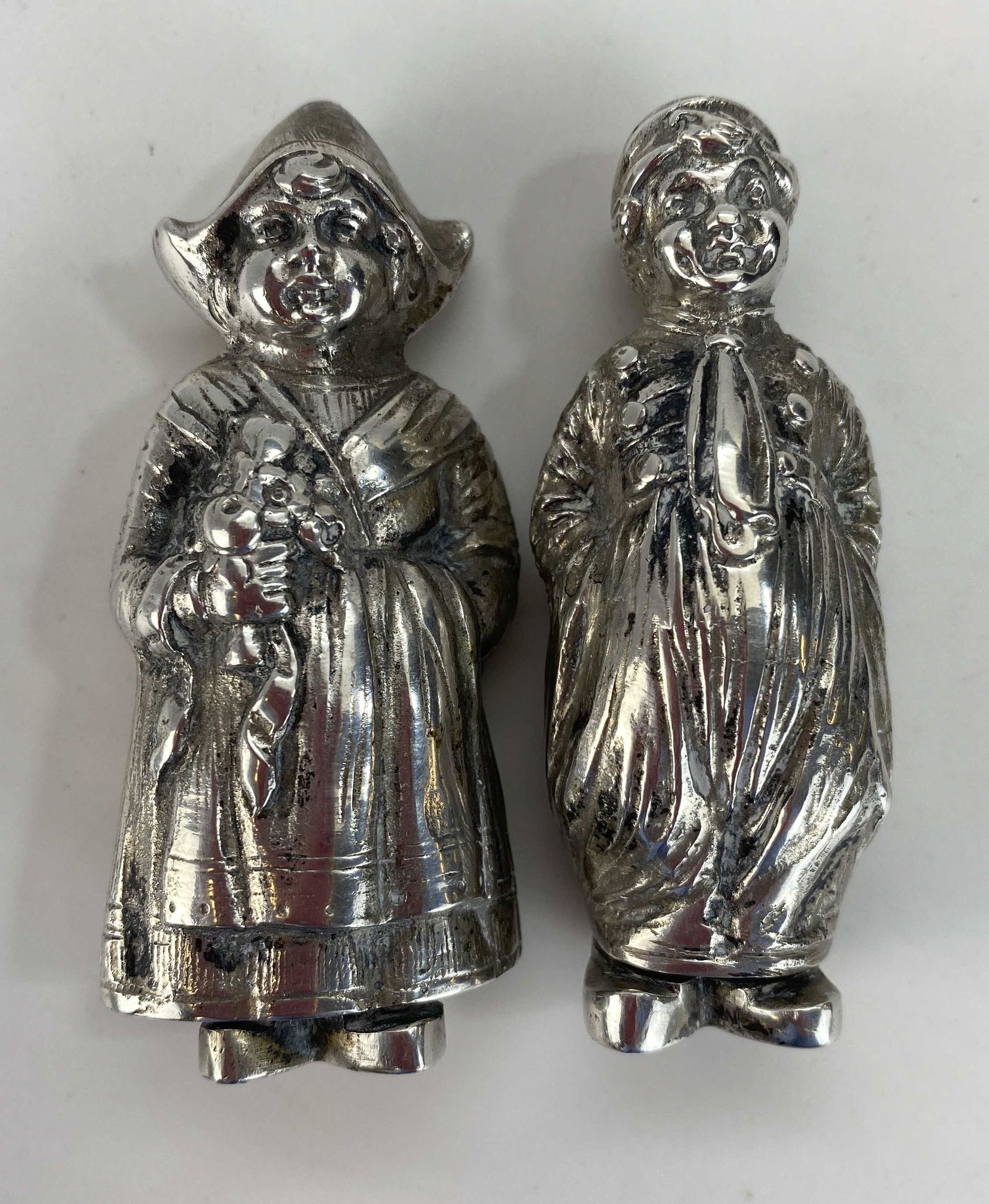 800 Silver Figural Dutch Boy, Girl Salt and Pepper: The tallest measures 2 3/4" tall. The combined total weight of the pair is 102 grams. Marked as shown.
