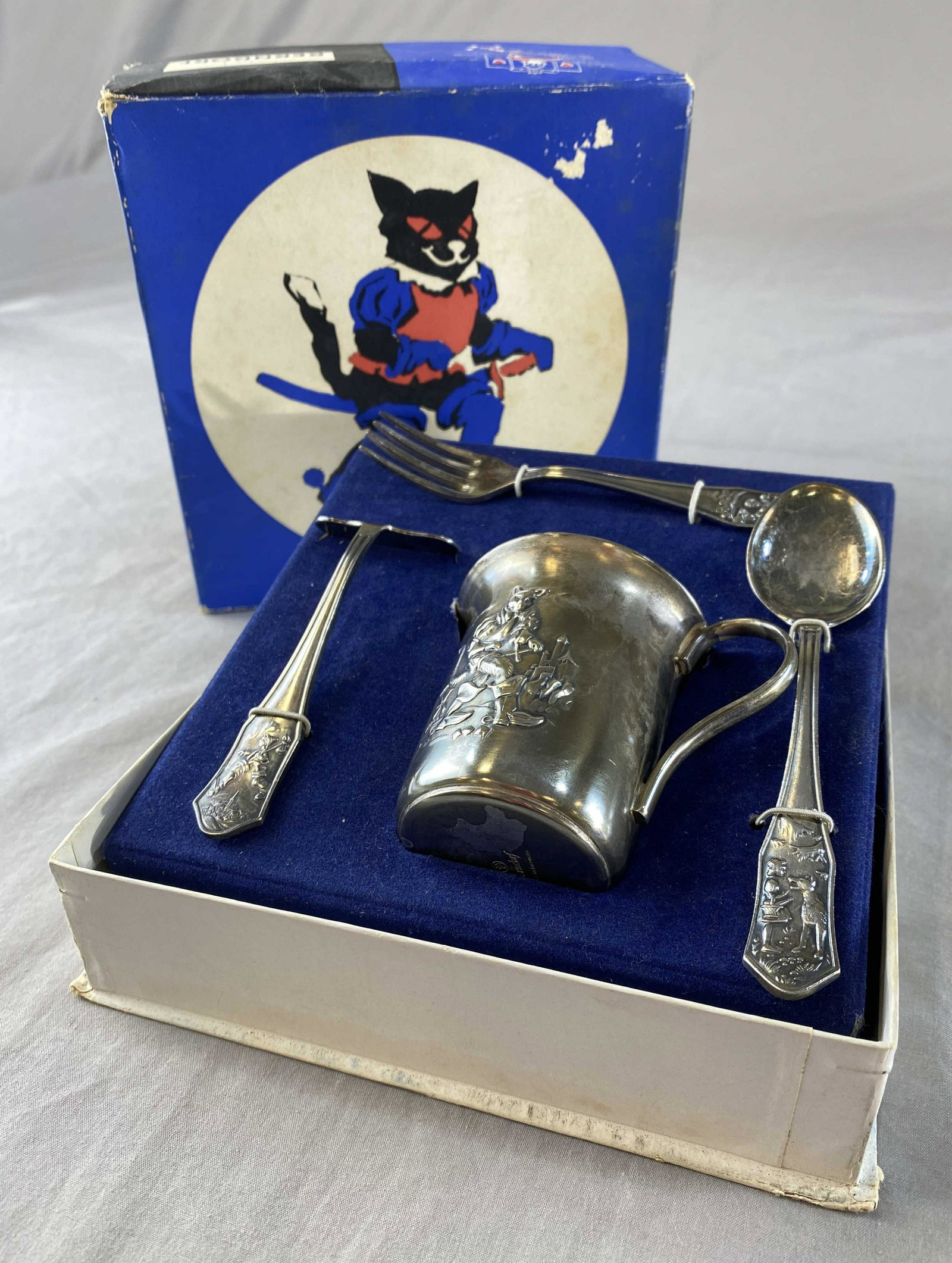 Berndorf Nursery Silver Plated Flatware and Cup: A fairy tale silver plated set from Berndorf - Germany in its original box. It includes a cup, fork, spoon and food pusher.