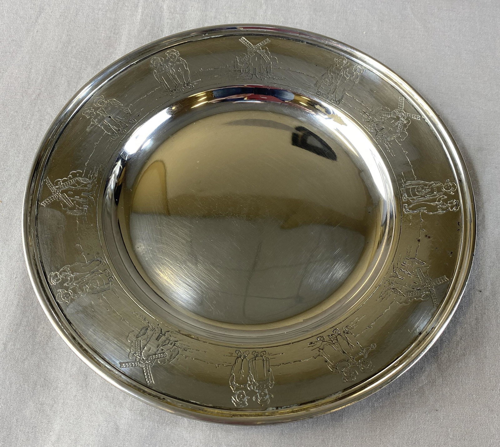 Gorham Sterling Child's Plate - Dutch Children: Sterling silver from Gorham, this plate measures approximately 6 1/2" in diameter and weighs 108 grams. Marked as shown.