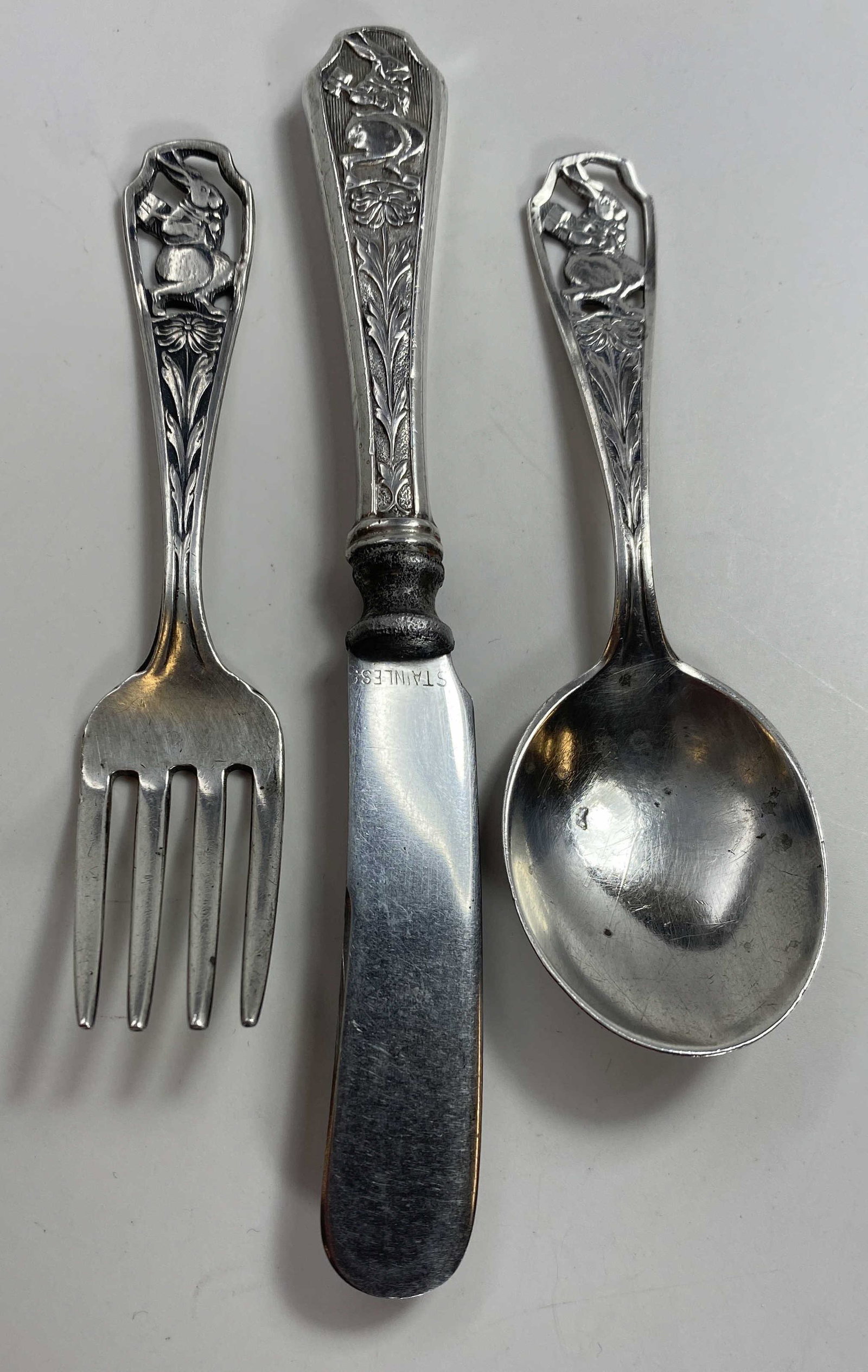 Webster Sterling 3 Pc Peter Rabbit Baby Flatware: Includes a spoon, a fork and a knife. Total weight of the 3 pieces is 43 grams.