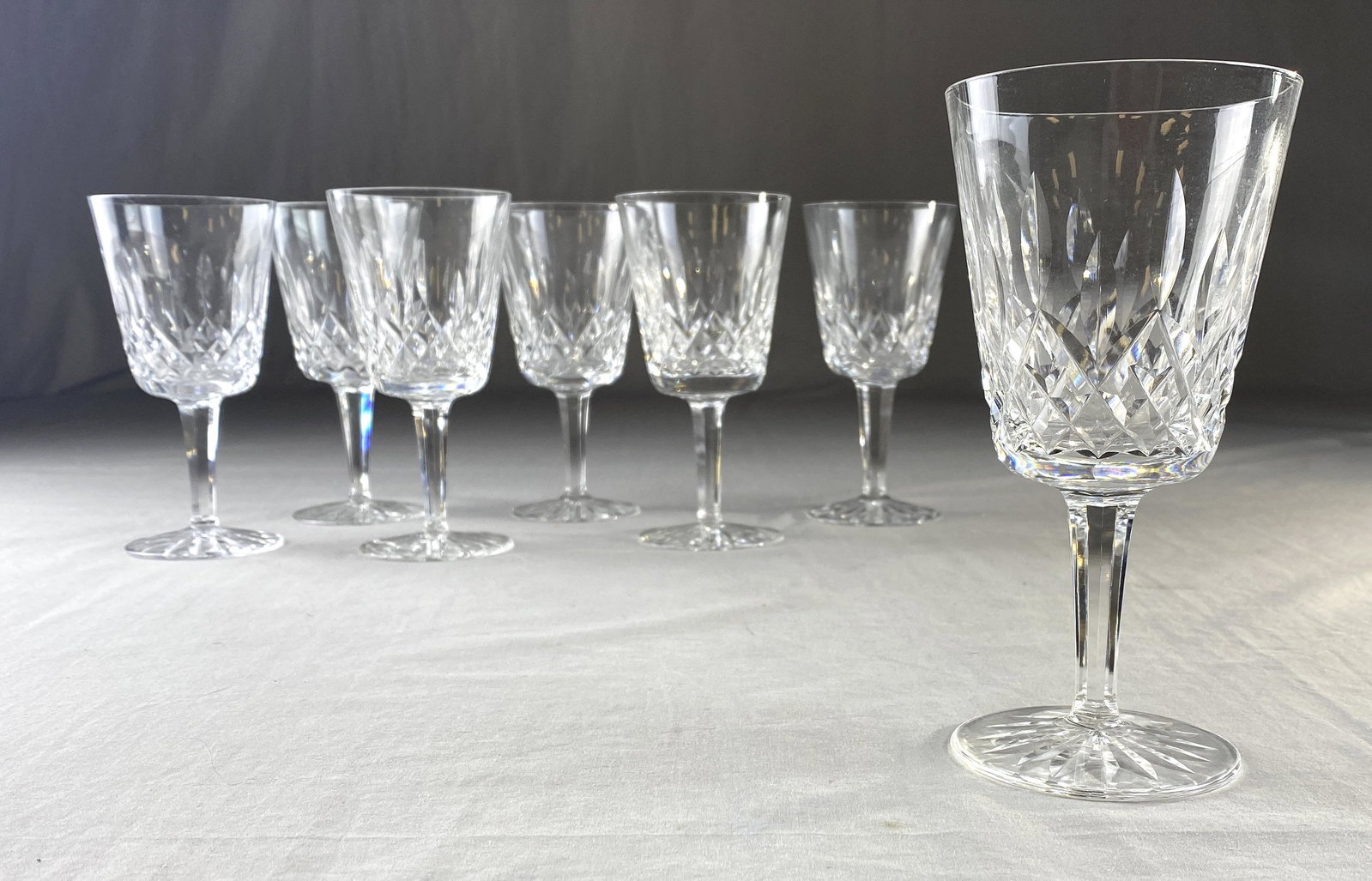 7 Waterford Lismore Cut Crystal Water Goblets: Set of seven water goblets in the Waterford "Lismore" pattern. Signed on the bottom. 7" tall.