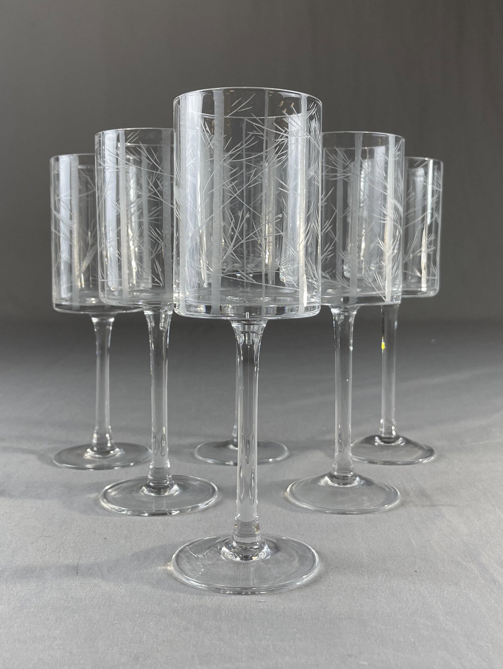 6 Fine Quality Etched Crystal Wine Glasses: A set of 6 fine quality crystal wine glasses etched in a bamboo pattern. Each glass measures 8 1/8" tall.