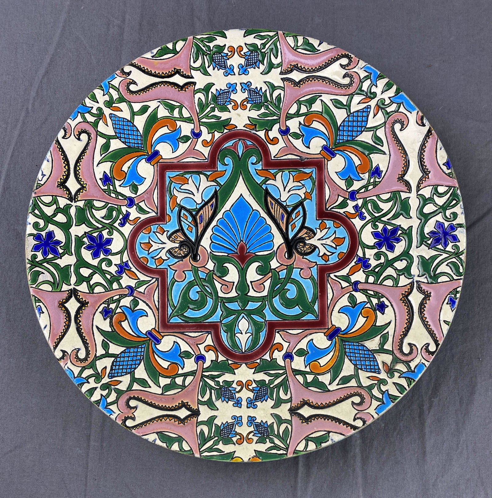 Charles Pickman Gran Medalla Faience Charger: Charles Pickman Sevilla faience charger in multicolor enamel in an Asian motif. The impressed mark on the back indicates the winning of the Gran Medalla Oro Paris in 1878. Diameter 12-3/8"