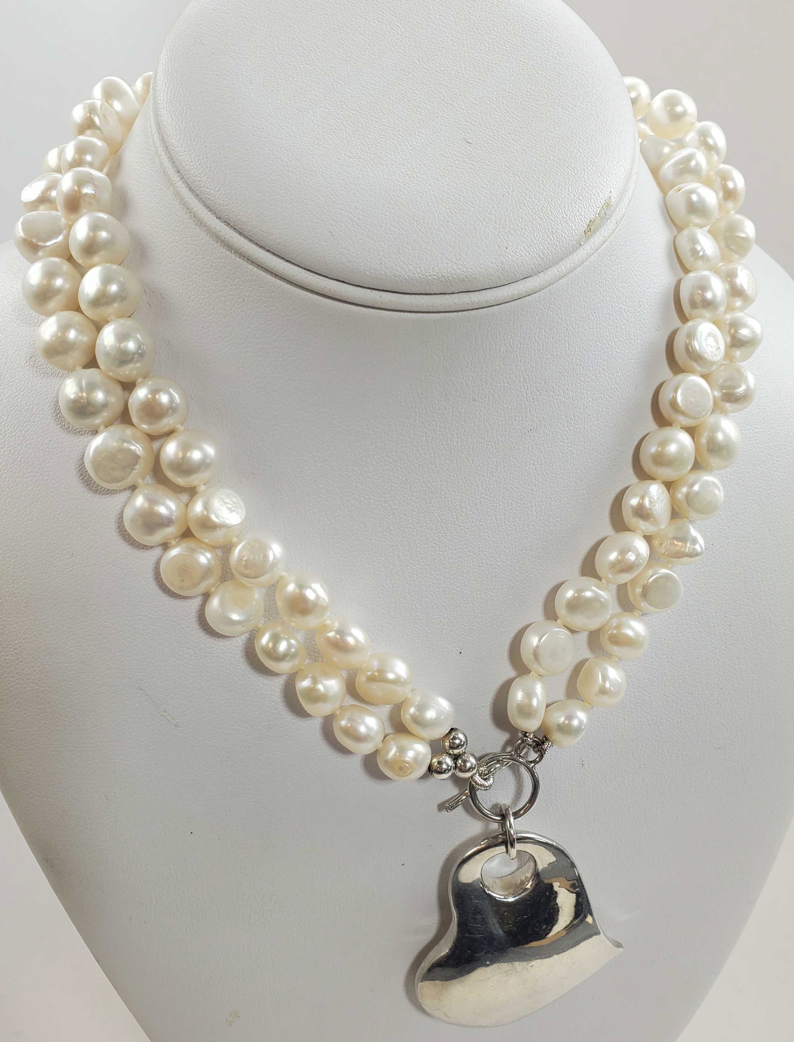 Simon Sebbag Sterling Heart And Pearl Necklace: This beautiful 16" two strand choker style necklace with pearls and a sterling silver heart charm. (Heart is 16.5 grams). Marked. Comes with dust bag.