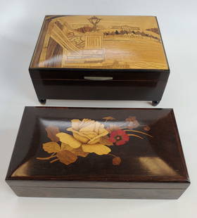 Lot Of 2 Vintage Wooden Inlay Jewelry Boxes: (1) footed wooden inlay music/Jewelry box 7 1/2" length 5 1/2" depth 3" height music unknown. (1) wooden inlay trinket/Jewelry box with floral design 7 1/2" length 4" depth 2" height.