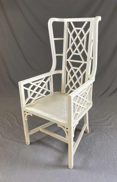 Chinese Chippendale Style Garden Wing Chair: A Chinese Chippendale wing back garden chair with intricate fretwork and a cane seat. Height 48" Width 22-1/2" Shipping: This item is not eligible for in-house shipping. It may be picked up locally by