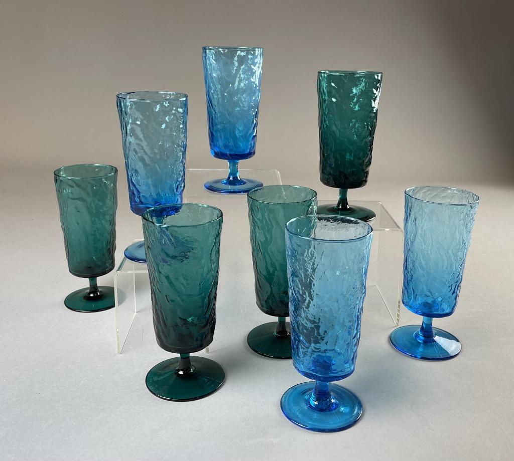 8 Midcentury Crinkle Glass Footed Tall Goblets: 8 blue and green footed high ball, iced tea or pilsner glasses. Each glass measures 7-1/4" tall.