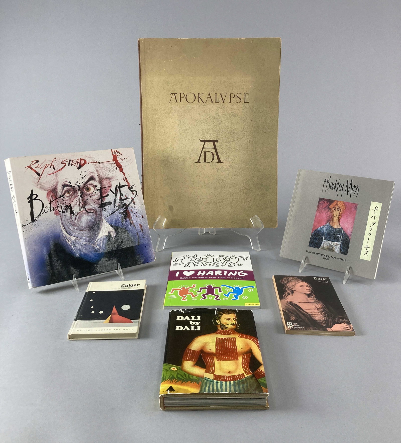 Art Books Haring, Calder, Steadman, Durer & Dali: Collection of Seven Books on the specific art and lives of seven artists. Apokalypse by Albrecht Durer published by Buerger Verlag 1946. Written in German. Between the Eyes by Ralph Steadman, publishe