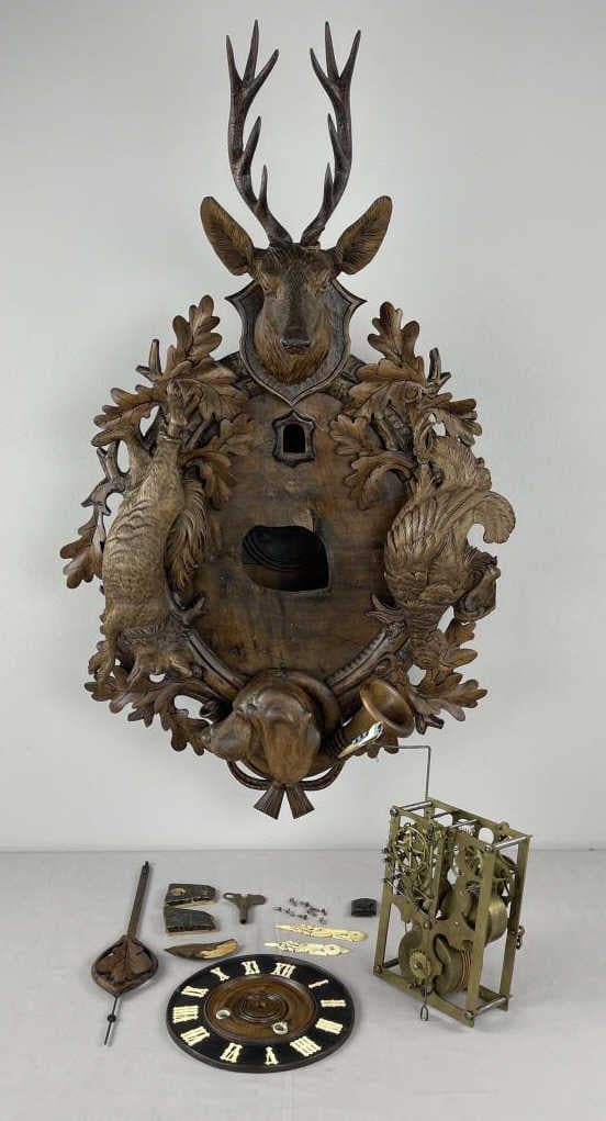8 Day Fusee Hunter Motif Cuckoo Clock - Parts: Circa 1900 German Black Forest handcrafted deer head, pheasant, fox and dog hunter motif on rare single shield no gable. Key wind, spring barrel, gut line Fusee movement. Bone carved hands. Key includ