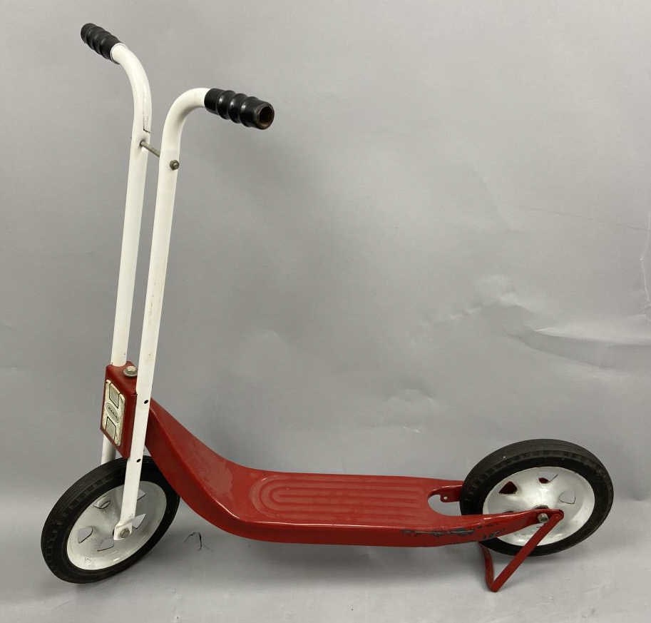 Hamilton Snappy Red Scooter: Red scooter with white handlebars and a "radio" on the front with kickstand for back wheel. Scooter is 32 inches tall and 32 inches long. SHIPPING INFORMATION: In-House Shipping Available