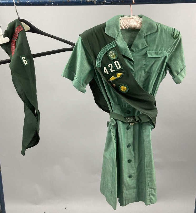 Vintage Girl Scout Uniform With Sash & Belt: 1950's Girl Scout junior uniform dress with short sleeves, includes belt and two sashes. Belt is marked 0-132 Medium. Dress measurements lying flat are 4 1/2 inch neck, 15 inch chest, 11 inch waist an