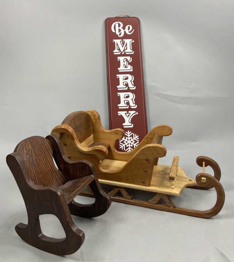 Wooden Doll Rocker, Sleigh, Be Merry Sign: Red Be Merry sign from Sears, 36 X 9 in. Handmade doll size wooden rocking chair, 13 in. tall, 7 1/2 in. wide. Musical wooden doll size sleigh, plays "We Wish You a Merry Christmas". Sleigh is 12 3/4