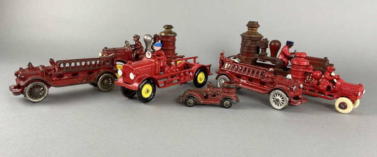 Seven Cast Iron Fire Engines: Kenton Toys fire engine, marked Kenton Toys Kenton Ohio. Hubley cast iron fire engine wit yellow wheels. Fire Pumper, possibly Hubley or Kenton. Kenton ladder truck. AC Williams cast iron two man ladd