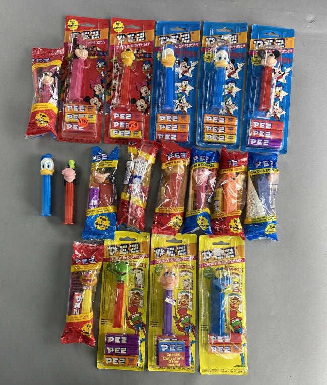 Disney & Muppets Pez Pooh, Mickey, Kermit: Eighteen Pez Dispensers featuring characters from Disney, Winnie the Pooh, and The Muppets. All but two are still with their original packaging, some packaging is loose. Lot includes 2 Minnie Mouse, 1