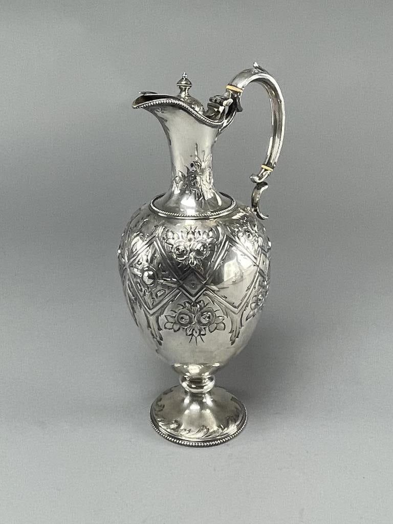 19th C. Martin Hall & Co. Silver Plated Wine Ewer: Silver plated claret wine decanter/jug with elaborate repoussé and chased decoration. Hallmarked as shown. Height 12-1/2". From the collection of Phillip Siebert. SHIPPING: In-House Shipping Avai