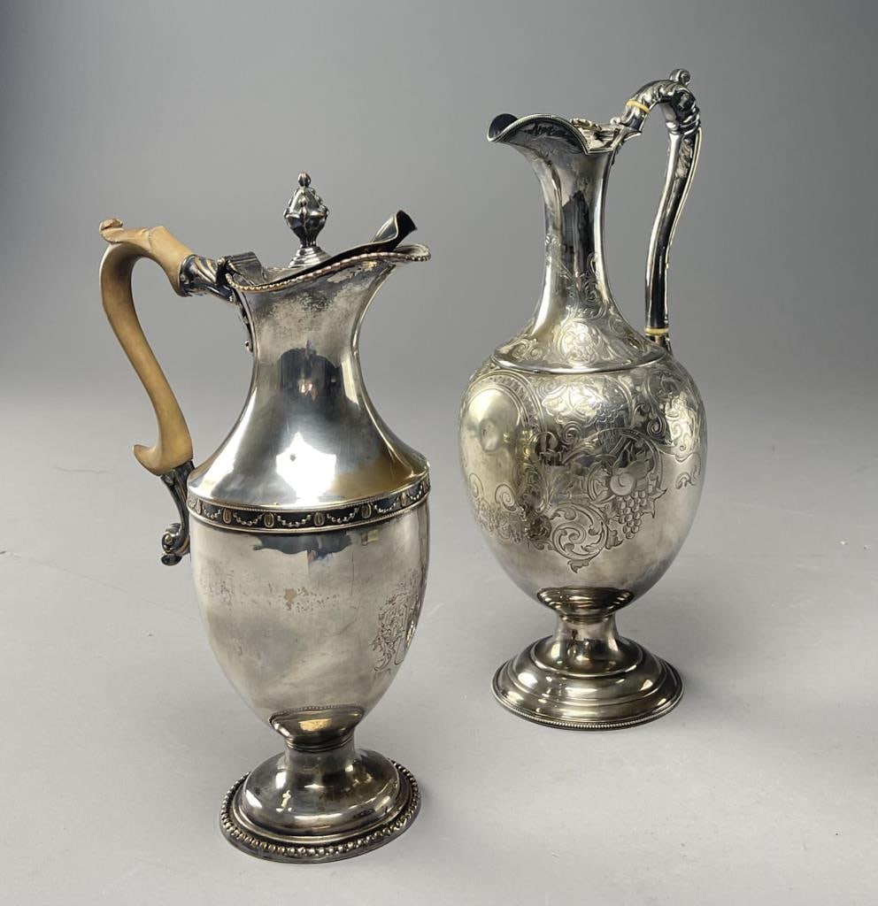 Two Silver Plated Wine Ewers, 19th and 20th C.: The first is 19th century, ornately chased the second in neoclassical style with engraving indicating the date of 1932. The taller measures 13". From the collection of Phillip Siebert. SHIPPING: In-Ho