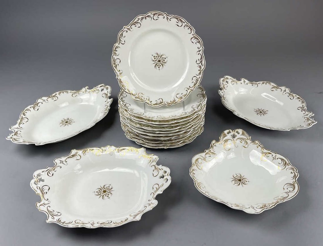 Mid 19th Century Paris Porcelain for 12: Mid 19th century old Paris porcelain in a scalloped and pierced shape with ornate gold border trim and central medallions. Unmarked. Includes: (12) 8 3/4" dinner plates,(2) 12" serving bowls, (1) 11" 