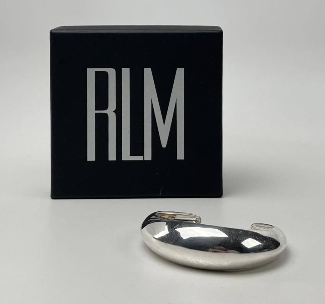 Robert Lee Morris Silvered Bronze Bracelet: Signed and marked as bronze as shown. Includes original packaging. CONDITION: Shows some light wear. SHIPPING: In-House Shipping Available for this lot. Please read our Shipping Terms and Conditions a