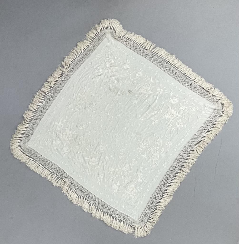 Chinese Silk Ivory Monochromatic Piano Shawl: Ivory toned bird and flower embroidery on an ivory ground. 39" square not including the 6" fringe. From the collection of Phillip Siebert. CONDITION: 3 minor spots shown in photos. SHIPPING: In-House