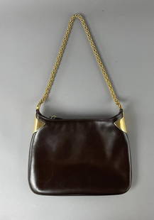 Vintage Gucci Brown Leather Shoulder Bag: Gucci shoulder bag purse with heavy gold toned accents and chain, zipper closure. 12" x 10". CONDITION: Light wear overall from normal use. SHIPPING: In-House Shipping Available for this lot. Please r