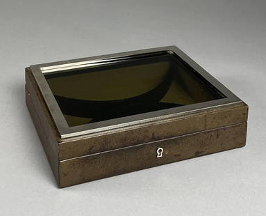 Mark Cross Leather, Chrome, Glass Jewelry Box: Made in Italy for Mark Cross, a leather jewelry box with a smoke glass top, trimmed in chrome, suede interior with adjustable dividers. Circa late 20th century. 11" x 8-3/4" x 3" tall. CONDITION: The