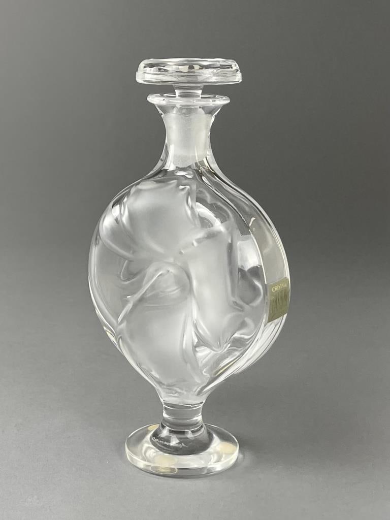 Lalique Crystal "Moulin Rouge" Perfume bottle: Height 6-3/4". SHIPPING: In-House Shipping Available for this lot. Please read our Shipping Terms and Conditions and Shipping Policies prior to bidding in this auction.