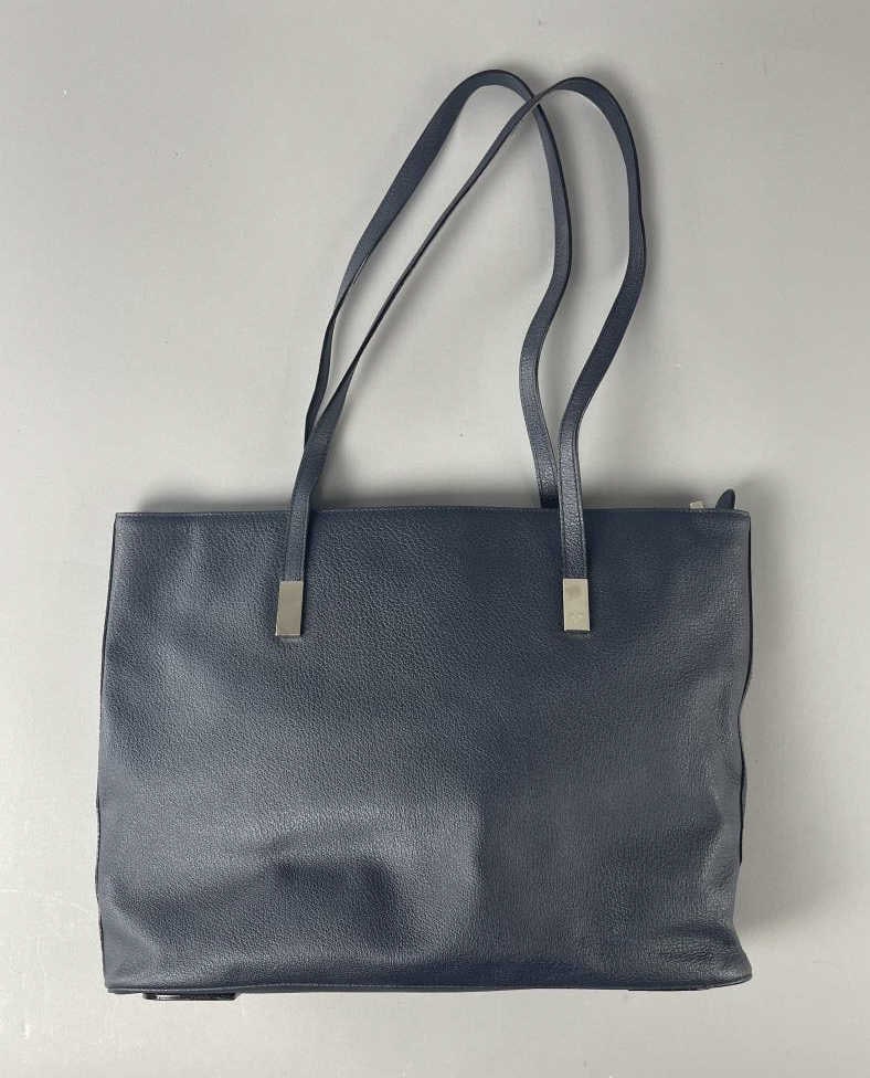 Escada Navy Blue Italian Leather Handbag: Large navy blue handbag from Escada, made in Italy. Zipper closure and interior zippered pocket. 17" x 11". SHIPPING: In-House Shipping Available for this lot. Please read our Shipping Terms and Condi