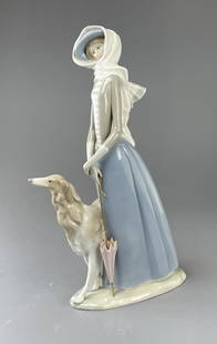 Lladro Lady with Dog Porcelain Sculpture: "Dama con Galgo" large porcelain sculpture of a lady with a Russian Wolfhoundfrom Lladro, made in Spain. Height 15-1/2". SHIPPING: In-House Shipping Available for this lot. Please read our Shipping Te