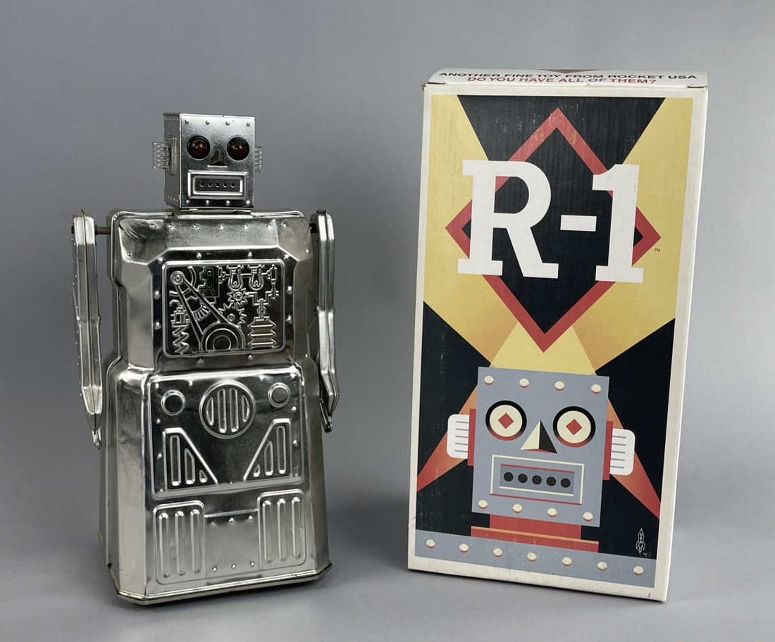 Vintage Rocket USA R-1 Battery Operated Robot: Tin litho Robot One bump'n go action in original box. Appx 13'' tall SHIPPING: In-House shipping available. Please read our Shipping Policies prior to bidding.