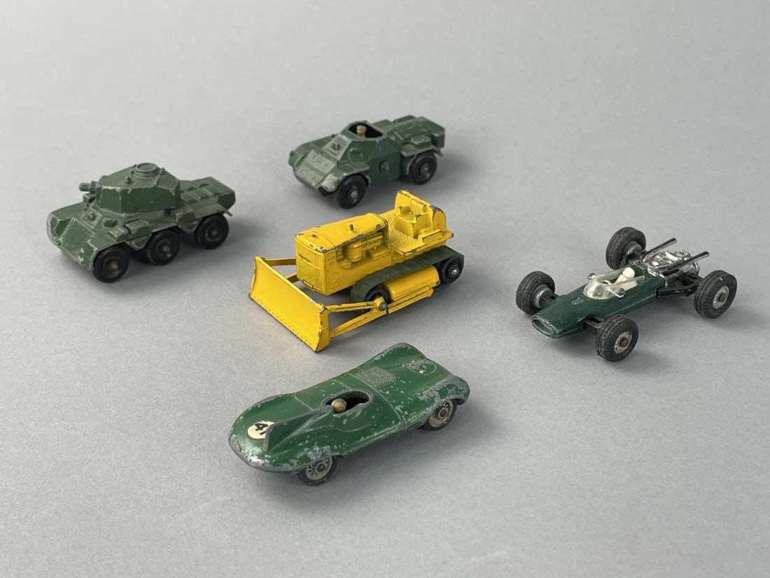 Vintage Matchbox Die Cast Cars & Penny No/15 Lotus: Matchbox Series No. 18 Caterpillar D8 BulldozerMatchbox Series No. 61 Ferret Scout CarMatchbox No. 67 "Saladin" Armoured Car 6x6 - barrel broke offMatchbox No. 41 D Type JaguarPenny No/15 Lotus - BRM