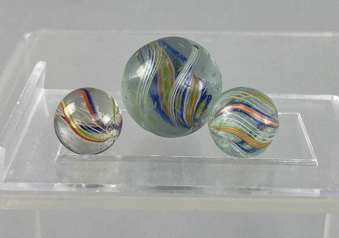Vintage Swirl Ribbon Latticino Marbles: Three vintage marbles. 5/8 inch and 1 inch in sizeDivided core swirl SHIPPING: In-House shipping available. Please read our Shipping Policies prior to bidding.