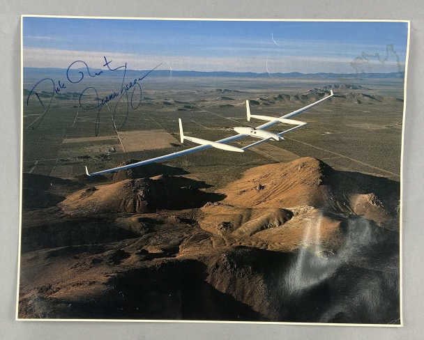 Voyager Aircraft Test Flight Photo Signed: Photo of the Voyager test flight from 1981 before a first attempt at a non-stop, non-refueled flight around the world in 1986. Photo is signed in pen by flight crew members Dick Rutan and Jeanie Yeage