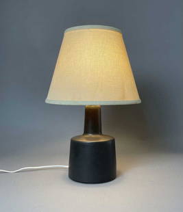 Martz for Marshall Studios Modernist Pottery Lamp: Midcentury modern pottery lamp by Jane and Gordon Martz. for Marshall Studios. It is in a dark brown satin glaze. Signed and retains part of the original label. Has an old if not original linen shade.