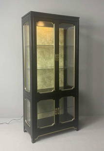 Black Lacquer Lighted Curio Display Cabinet: Black lacquered with gilt trim, lighted cabinet with 4 glass doors and glass paneled sides. Marked American Furniture and dated 1979. Height 72-1/4", width 32", depth 16-1/4".