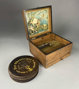 Polyphon German Music Box with 18 Discs: Circa 1900 Polyphon music box numbered 157568. Also included are 18 metal music discs. The box measures 10-1/2" x 9-1/2" x 6-1/2" tall. The discs measure just over 8" in diameter.