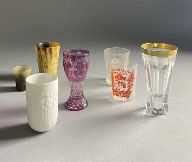 7 Interesting Tumblers Moser, Rosenthal, Horn: Seven interesting tumblers, cut glass, Bohemian, horn, George VI Coronation and Rosenthal porcelain Bjorn Wiinbald, with the tallest tumbler being 6". From the collection of Kenneth Beachler.