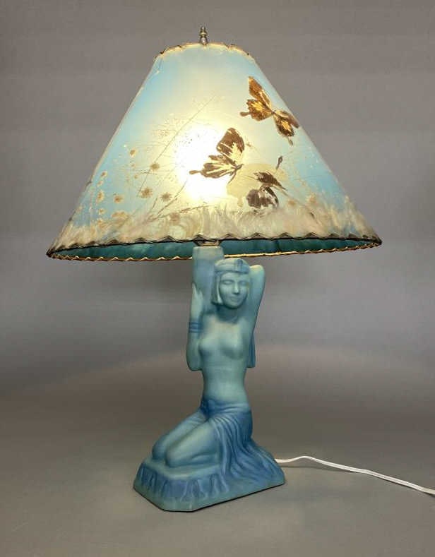 Van Briggle Pottery Damsel of Damascus Lamp: Egyptian revival style lamp in turquoise blue from Van Briggle of Colorado. Includes what appears to be the original butterfly shade. Height to top of finial 25", to top of socket 16".