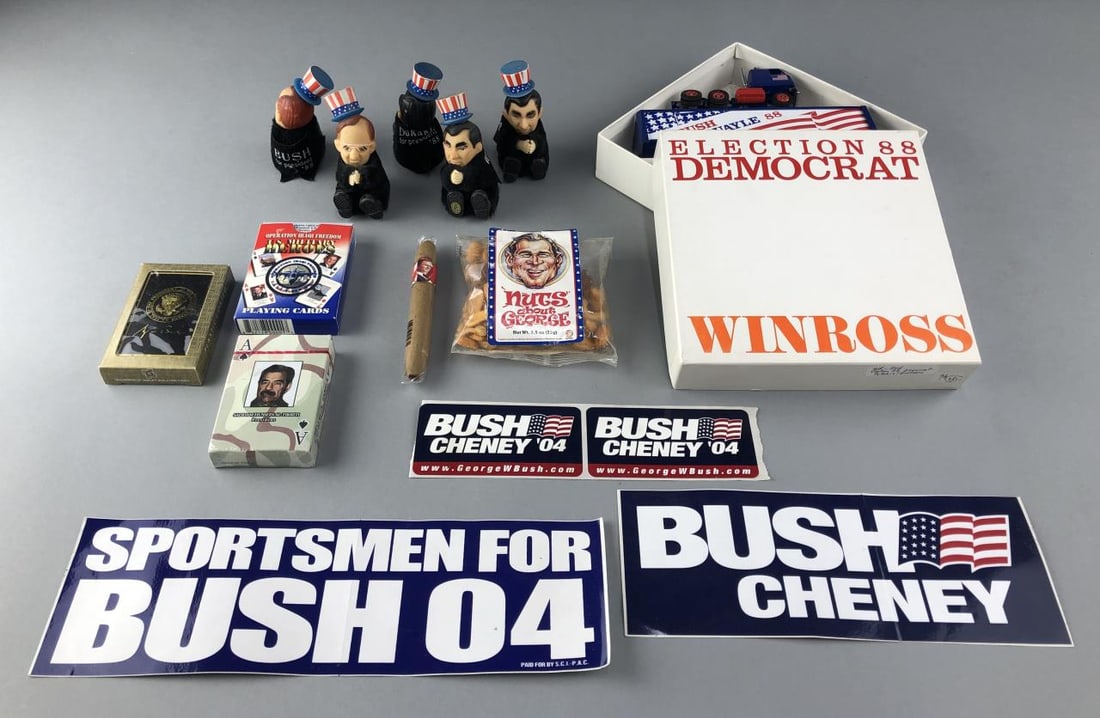 George W. Bush Unique Collectables: George W. Bush election bumper stickers - unused. 5 clip on dolls from '88 election, unopened bag of nuts: "Nuts about George", a Bush cigar still sealed, '88 Winross semi truck with Bush/Quayle on it