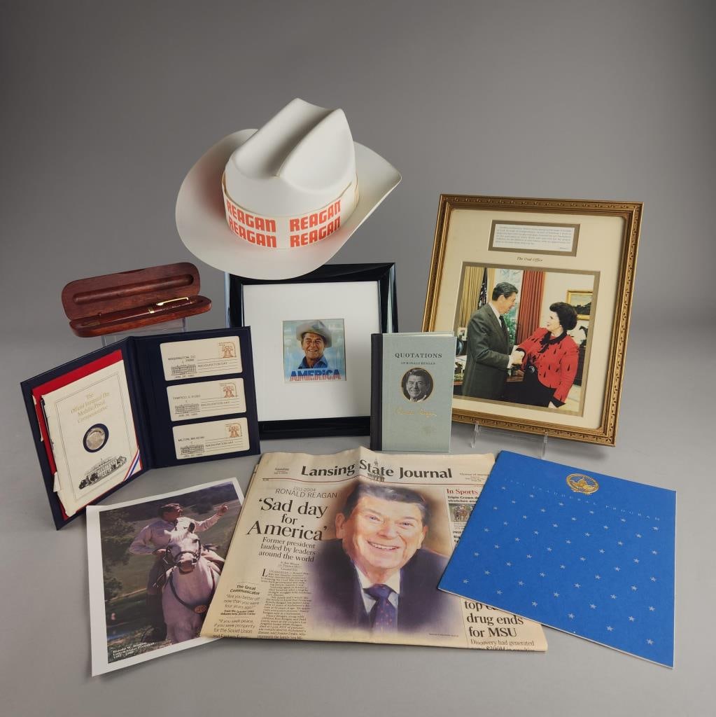 Ronald Reagan Collectables: Reagan framed image in oval office - measuring 11" x 13" and another measuring 9.75" x 9.75", plastic Reagan campaign cowboy hat, inaugural collectable coin, inaugural program, presidential pen in woo
