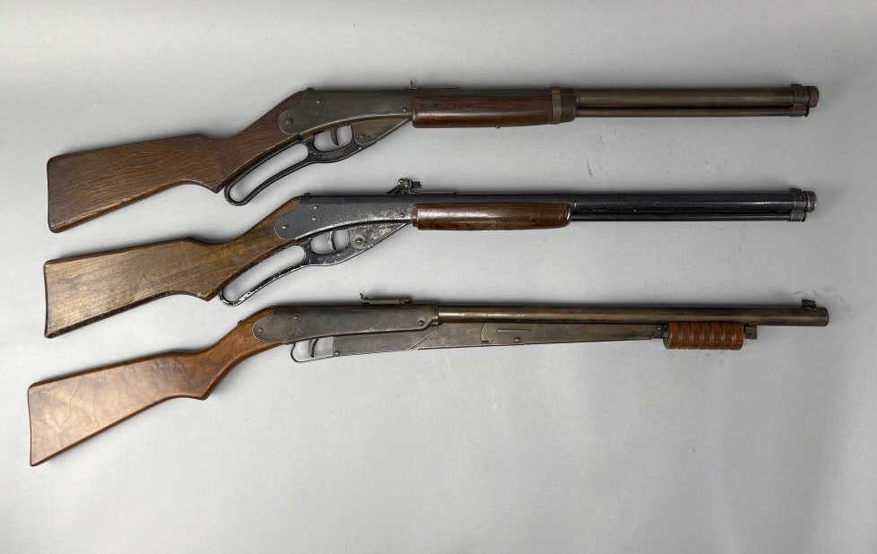 Daisy No. 25 and two No. 111 Model 40 Red Ryders: 1930s-1950s (pre-registry numbers) Daisy No. 25 made in Plymouth, MI. Pistol grip stock, medium take down screw, 6 groove pump handle, small rear sight, groove butt stock, reinforcing tang. Appx. 37''