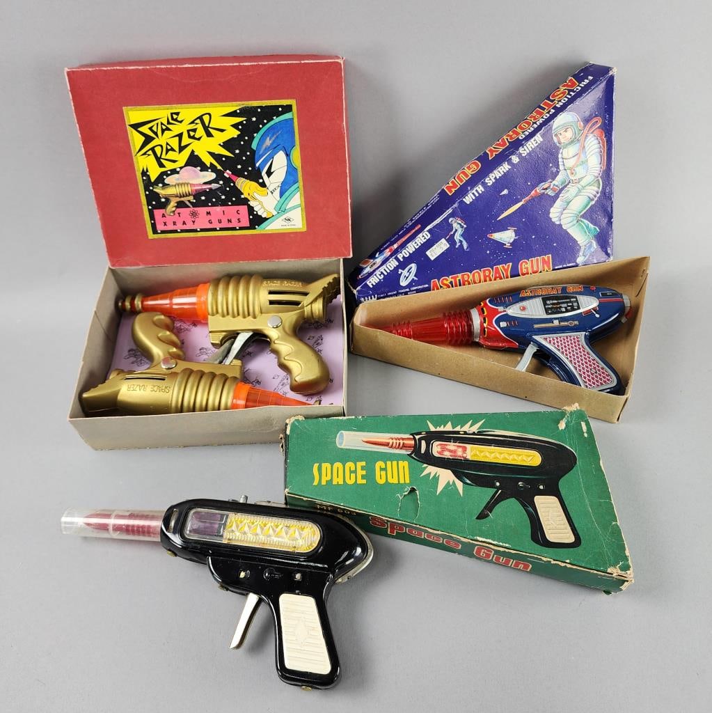 Space Gun, Astroray Gun, Space Razers: Space Gun MF 603, Made in China tin friction toy gun in box, end of box damaged.Space Razer Atomic Xray Guns in box, NK Made in China, plastic friction gun.Astroray Gun COTC CT-309, Made in Korea, in