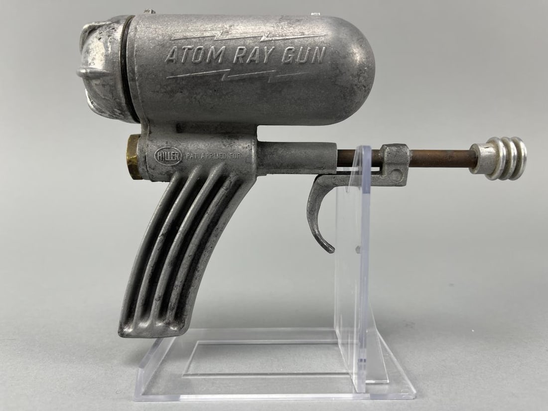 Hiller Atom Ray Squirt Gun: Hiller Mfg.USA, c. 1948cast aluminum4.5 h x 1.5 w x 6.25 d in (11 x 4 x 16 cm)