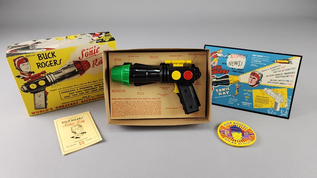 Buck Rogers Sonic Ray Gun & Advertising Cardboard: Norton Engineering & Mfg. Co.In original box with paper, advertising pop up cardboard store display Commonwealth Utilities Co. and appx 3'' Buck Rogers Solar Scout patch.