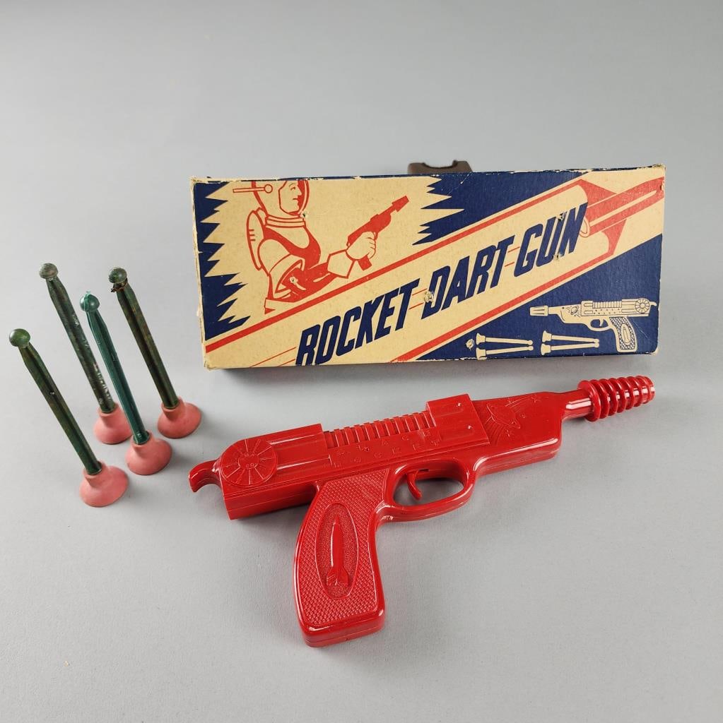 Rocket Dart Gun with Darts in Original Box: Has all 4 original darts. All Metal Products Co. Wyandotte, Michigan. Box measures 10.5" X 4" X 1".