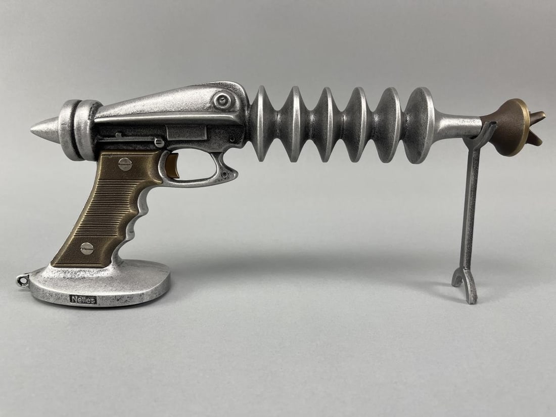 Nelles Studio Metal Laser Space Gun: Dated 2010. The piece is nicely formed and has a good surface. Signed and dated at bottom edge. L15"