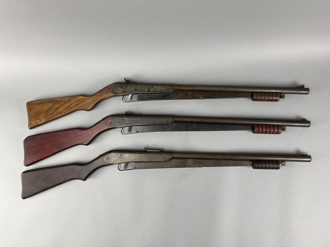 3 - Daisy No. 25 Pump Action Pistol Grip BB Rifles: Pre-registry Daisy No. 25 made in Plymouth, MI. Medium take down screw, 6 groove pump handle, small rear sight, welded barrel anchor, groove butt stock, reinforcing tang, engraved receiver. Appx. 37''