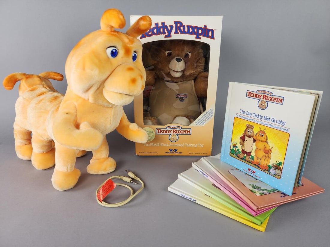 WOW Teddy Ruxpin in Box, Grubby and 5 Books: Worlds of Wonder Teddy Ruxpin, appx 19'' doll in box. Worlds of Wonder Grubby the Worm, appx. 19'' x 15'' x 7'' with original Grubby's Animation cord. 5 The World of Teddy Ruxpin Books-Teddy and the M