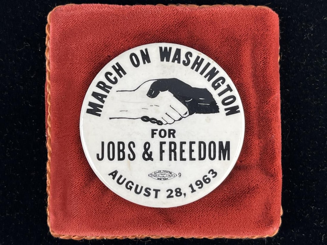 1963 March on Washington for Jobs & Freedom Pin: March on Washington for Jobs and Freedom August 28, 1963 pinback button, with Allied Printing, New York logo at bottom center, featuring the iconic image of black and white hands shaking, 2-1/4" D. Th